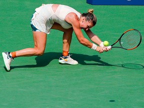 Number one seeded Simona Halep of Romania chases down a return to Kaia Kanepi of Estonia during their 2018 U.S. Open women's match Aug. 27, 2018 in New York.