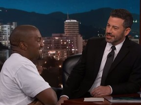 Kanye West laughs while talking to Jimmy Kimmel on his show on Thursday. (Jimmy Kimmel Live/YouTube)