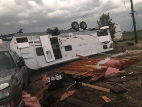 An overturned trailer is shown after a tornado at Margaret Bruce Beach, east of Alonsa, Man., on Friday, Aug.3, 2018. A tornado that touched down west of Lake Manitoba on Friday night tore at least one home off its foundation, a spokesman for Environment Canada said Saturday.