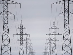 Manitoba Hydro made millions less in income last year and the Crown expects its long-term debt to grow by $25 billion in the next five years. Manitoba Hydro power lines are photographed just outside Winnipeg, Monday, May 1, 2018. The Crown's annual report shows Hydro made $37 million in net income for the fiscal year ending March 31, down from $71 million the year before.