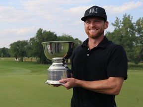 Tyler McCumber poses with the trophy after winning The Players Cup at the Southwood Golf and Country Club in St. Norbert, Man., on Sunday. (Kevin King/Winnipeg Sun)