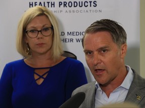 Sustainable Development Minister Rochelle Squires (left) and Health, Seniors and Active Living Minister Cameron Friesen (right) announces a five-year renewal of the Manitoba government's partnership with the Health Products Stewardship Association's Medication Return Program in a Shoppers Drug Mart pharmacy in Winnipeg on Aug. 22, 2018. 
Danton Unger/Winnipeg Sun