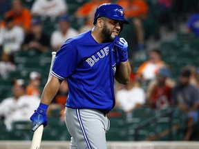 Toronto Blue Jays' Kendrys Morales walks off the field after striking out swinging in the eighth inning of a baseball game against the Baltimore Orioles, Monday, Aug. 27, 2018, in Baltimore.