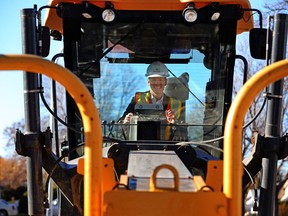 Mayor Brian Bowman sits in the cab of a grader on Oct. 22, 2015. Kevin King/Winnipeg Sun