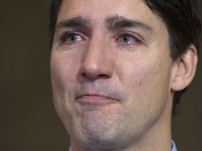 Tears roll down Prime Minister Justin Trudeau's face as he speaks about Tragically Hip singer Gord Downie before caucus on Parliament Hill, in Ottawa on Wednesday, October 18, 2017. THE CANADIAN PRESS/Adrian Wyld