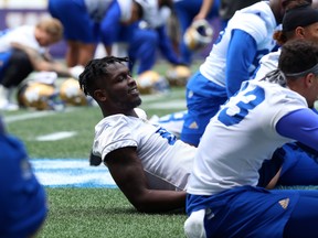 Blue Bombers’ Corey Washington stretches during a recent practice. Washington worked with the first team in practice all week and is intent on taking to the field for Sunday’s game against the Roughriders. (WINNIPEG SUN FILES)