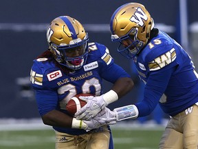 Winnipeg Blue Bombers RB Timothy Flanders takes a handoff from QB Matt Nichols during the CFL West semi-final against the Edmonton Eskimos in Winnipeg on Sun., Nov. 12, 2017. Kevin King/Winnipeg Sun/Postmedia Network ORG XMIT: POS1711121726183739