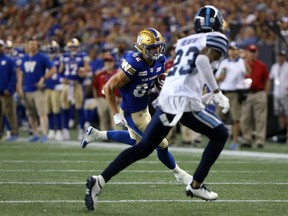 Winnipeg Blue Bombers WR Drew Wolitarsky runs for a touchdown past Toronto Argonauts DB T.J. Heath during CFL action in Winnipeg on Fri., July 27, 2018. Kevin King/Winnipeg Sun/Postmedia Network