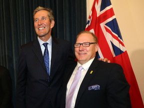 Manitoba Premier Brian Palmister (left) shuffled his cabinet in Winnipeg today.   Pallister is pictured here with Scott Fielding, MLA for Kirkfield Park.  Wednesday, August 01/2018 Winnipeg Sun/Chris Procaylo/stf