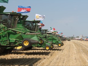 Some of the 303 combines that successfully set a new world record. A new Guinness World Record was set just south of Winkler, on Saturday, Aug. 4, 2018, when 303 combines harvested the same crop of winter wheat continuously for five minutes. The world record attempt was a fundraiser for Children’s Camps International, and was anticipated to raise close to $5 million, enough to send 1 million kids to camp in developing countries. (LAUREN MACGILL/Winkler Times)
