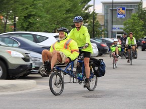 Despite being diagnosed with Parkinson's Disease, 77-year-old Rick Riewe and his wife Jill Oakes pedal into the Sage Creek shopping centre parking lot in Winnipeg, completing a 10,000-kilometre cycling journey across the United States and Canada on Monday.