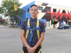 Kenneth Lavallee is an artist, in Winnipeg.  The mural, Star Blanket Project, is in the background.   Saturday, August 18/2018 Winnipeg Sun/Chris Procaylo/stf