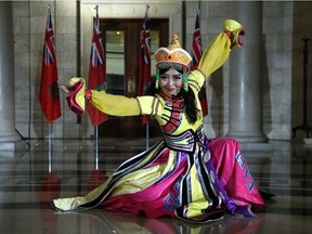 A representative of Folklorama's Chinese Pavilion performs in the rotunda of the Manitoba Legislative Building in Winnipeg during a multicultural celebration on Mon., Aug. 20, 2018. Kevin King/Winnipeg Sun/Postmedia Network