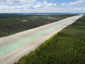 Provincial crews work on building the Lake St. Martin channel, July 2014.   Government of Manitoba handout