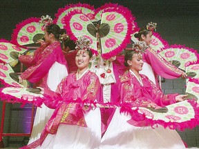 Members of the Manitoba Korean Dance Group perform the Fan Dance at the Korean pavilion.