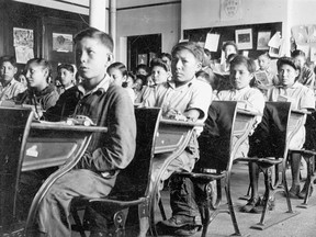 Residential school students in a typical classroom.