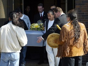 Pallbearers carry the casket of Brian Sinclair from the Bardal Funeral home following Sinclair's funeral. Sinclair died earleier in the week after waiting 34 hours in an emergency room waiting area.