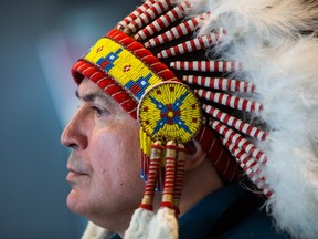 Assembly of First Nations National Chief Perry Bellegarde waits to lead the grand entry at the opening of the AFN Annual General Assembly, in Vancouver on Tuesday, July 24, 2018. THE CANADIAN PRESS/Darryl Dyck ORG XMIT: VCRD110