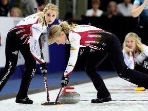 Second Jocelyn Peterman, left, and lead Dawn McEwen sweep as skip Jennifer Jones of Winnipeg watches during the first draw at the Princess Auto Elite 10 at Thames Campus Arena in Chatham, Ont., on Wednesday, Sept. 26, 2018. Jones and her teammates are the reigning women's world champions. Ten women's teams and 10 men's teams are playing in the $200,000 Grand Slam of Curling tournament that ends Sunday, Sept. 30, 2018. Mark Malone/Chatham Daily News/Postmedia Network