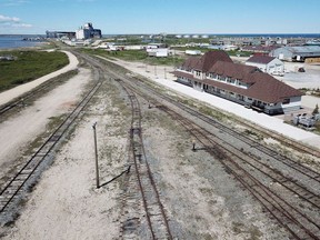 An aerial view of the rail line and Via Rail station is shown in Churchill, Manitoba, Wednesday, July 4, 2018. A deal has been reached to sell and repair a broken rail line that is the only land link for the northern Manitoba town of Churchill.