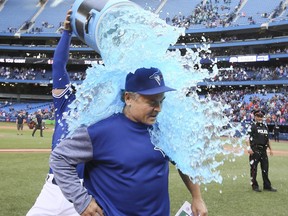 Blue Jays manager John Gibbons gets the Gatorade shower, courtesy of outfielder Kevin Pillar, after Toronto beat Houston on Wednesday. It was the final Jays home game for Gibbons, who will not return next season. VERONICA HENRI/TORONTO SUN