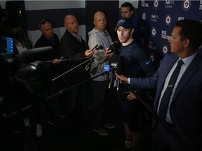 Winnipeg Jets' Bryan Little (18) talks to media after the first day of on-ice testing at the Jets NHL training camp testing in Winnipeg, Friday.
