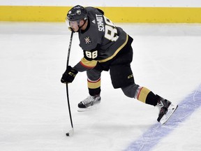File- This May 16, 2018, file photo shows Vegas Golden Knights defenseman Nate Schmidt skating with the puck against the Winnipeg Jets during Game 3 of the NHL Western Conference finals hockey playoff series in Las Vegas. The NHL has suspended Schmidt the first 20 games of the regular season for violating the league and Players' Association's performance enhancing substances policy. The league announced the suspension Sunday, Sept. 2, 2018. Schmidt released a statement saying he did not intentionally take a banned substance, adding, "I will not accept being labelled a cheater."