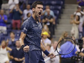 Novak Djokovic,of Serbia celebrates after beating John Millman of Australia 6-3, 6-4, 6-4 in the quarter-finals of the U.S. Open tennis tournament on Wednesday night in New York.