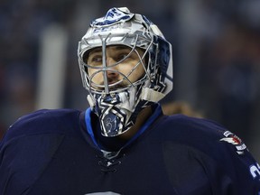 Winnipeg Jets goaltender Ondrej Pavelec takes a breather during NHL action against the San Jose Sharks in Winnipeg on Tues., Jan. 24, 2017. Kevin King/Winnipeg Sun/Postmedia Network ORG XMIT: POS1701242205542409