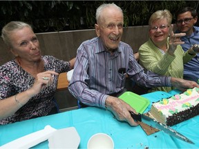 Bill Atkinson, 101 years old, has been a member of the YMCA-YWCA for 80 years, with the exception of the two years he spent serving in the Second World War. His eight decades of active membership were recognized Tuesday at the Y Winnipeg Downtown Branch. Bill was joined by his two daughters Samantha Atkinson (left), and Coralie Bornais.