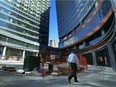 A man walks through True North Square in Winnipeg on Monday. The province announced Monday that it will use tax increment funding to support parts of its development.