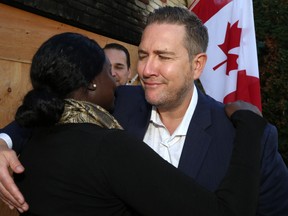 Richard Wagner embraces Gloria Renato, an APT dispatcher from Burnaby, B.C., at his home in St. Andrews on Wed., Sept. 19, 2018. Wagner and partner Nate Schnerch had an emotional reunion with Renato, who helped save their lives when their house went up in flames in the early morning hours of July 30. Kevin King/Winnipeg Sun/Postmedia Network