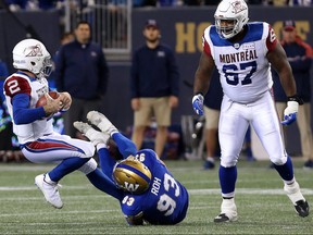 Montreal Alouettes QB Johnny Manziel is sacked by Winnipeg Blue Bombers DE Craig Roh during CFL action against the  in Winnipeg on Fri., Sept. 21, 2018. Kevin King/Winnipeg Sun/Postmedia Network