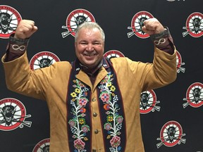 Manitoba Metis Federation President David Chartrand celebrates after signing an agreement with the federal government, Saturday at the Manitoba Metis Federation annual general assembly in Winnipeg on Saturday, Sept. 22, 2018. Federal Crown-Indigenous Relations Carolyn Bennett and Manitoba Metis Federation President David Chartrand announced Saturday the parties have agreed to a three-part plan for moving forward together to advance reconciliation with the Manitoba Métis Community. In order to support this plan, Canada will provide $154.3 million to the Manitoba Metis Federation as the parties continue to work to advance reconciliation.