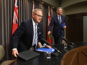 Manitoba's Finance Minister, Scott Fielding (left) enters a media conference, in Winnipeg, with Premier Brian Pallister.   Wednesday, September 26/2018 Winnipeg Sun/Chris Procaylo/stf