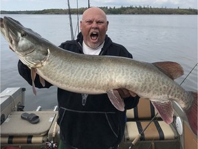 Fisherman shows off his prize catch.