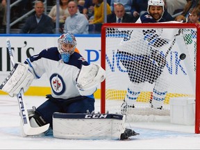 ST. LOUIS, MO - OCTOBER 4: Connor Hellebuyck #37 of the Winnipeg Jets looks to make a save against the St. Louis Blues at the Enterprise Center on October 4, 2018 in St. Louis, Missouri.  (Photo by Dilip Vishwanat/Getty Images)