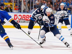 Kyle Connorof the Winnipeg Jets carries the puck up ice against the St. Louis Blues on Thursday in St. Louis.
