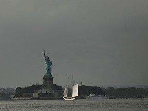 The Statue of Liberty stands in New York Harbor on October 9, 2018 in New York City. In a new United Nations report, climate scientists are urging people and global governments to take urgent action to keep global warming from exceeding 1.5C. The report predicts that hot extremes, heavy rains, droughts, wildfires and extreme flooding will increase as global temperatures continue to rise. A report released last year found that water surrounding New York City climbed 1.5 times faster than the global average. (Photo by Spencer Platt/Getty Images)