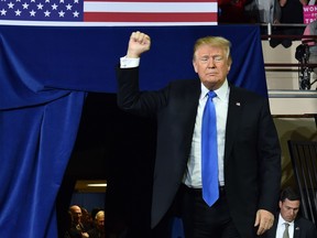 U.S. President Donald Trump arrives to a "Make America Great Again" rally at the Eastern Kentucky University, in Richmond, Kentucky, on Oct. 13, 2018. (NICHOLAS KAMM/AFP/Getty Images)