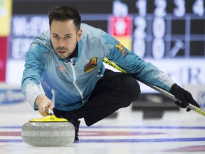 Skip John Epping releases a rock as he competes during the Olympic curling trials Monday, December 4, 2017 in Ottawa. (THE CANADIAN PRESS/Adrian Wyld)