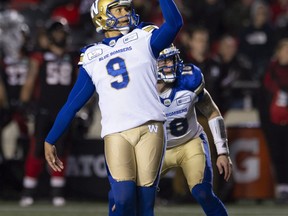Winnipeg Blue Bombers kicker Justin Medlock watches his successful field goal attempt sail through the uprights during first half CFL football action against the Ottawa Redblacks, in Ottawa on Friday, Oct. 5, 2018.