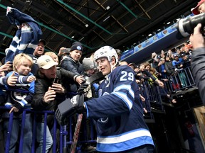 Winnipeg Jets forward Patrik Laine greet fans during the team's practice in Helsinki, Finland, on Wednesday.