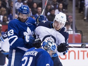 Toronto Maple Leafs goaltender Frederik Andersen (31) makes a save against a tip from Winnipeg Jets left wing Brandon Tanev (13) as Maple Leafs centre Nazem Kadri (43) look on during second period NHL hockey action in Toronto on Saturday, October 27, 2018. Kadri may be on the move from T.O. and the Jets would be a good landing spot for him says Ken Wiebe.