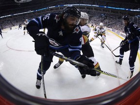 Winnipeg Jets veteran Mathieu Perrault is part of two newly formed lines Winnipeg Jets head coach Paul Maurice is testing out when the team opens its season Thursday in St. Louis. Perreault (85) is checked by Vegas Golden Knights' William Karlsson (71) during second period NHL Western Conference Finals game 5 hockey action in Winnipeg, Sunday, May 20, 2018. THE CANADIAN PRESS/Trevor Hagan ORG XMIT: CPT138