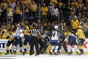 Several fights go on at once during the Jets-Predators game last night in Nashville, Tenn. The two teams combined for 76 penalty minutes. AP