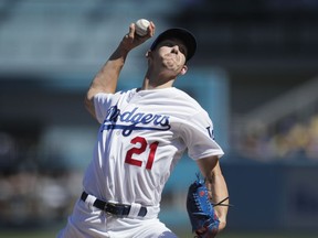 Los Angeles Dodgers starting pitcher Walker Buehler throws against the Colorado Rockies during the first inning of a tiebreaker baseball game, Monday, Oct. 1, 2018, in Los Angeles.