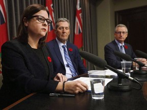 Justice Minister Heather Stefanson, left, speaks as Manitoba Premier Brian Pallister and Growth, Enterprise and Trade Minister Blaine Pedersen listen in at the Manitoba Legislature in Winnipeg on November 7, 2017. Some child and family services in Manitoba are worried that they will be pushed into block funding by the province despite concerns it will put vulnerable Indigenous children at risk.