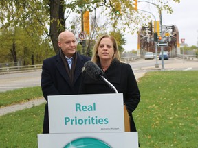 Winnipeg mayoral candidate Jenny Motkaluk, joined by Elmwood-East Kildonan Coun. Jason Schreyer, announces her plan to make the replacement of the Louise Bridge a top infrastructure priority for the City of Winnipeg on Tuesday.