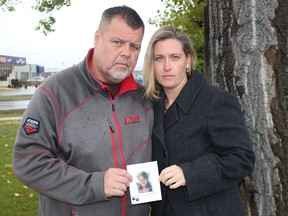 Keith Szostak and Cynthia Kulczycki hold an image of Shirley Yaroshinski, Szostak's mother, who passed away following a lengthy 911 wait in September.